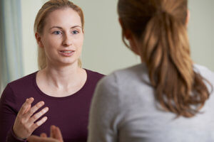 Woman receiving counseling as part of drug addiction treatment
