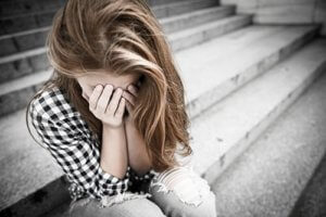 young woman struggling with her childhood trauma