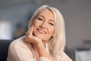 older woman smiles during life skills training